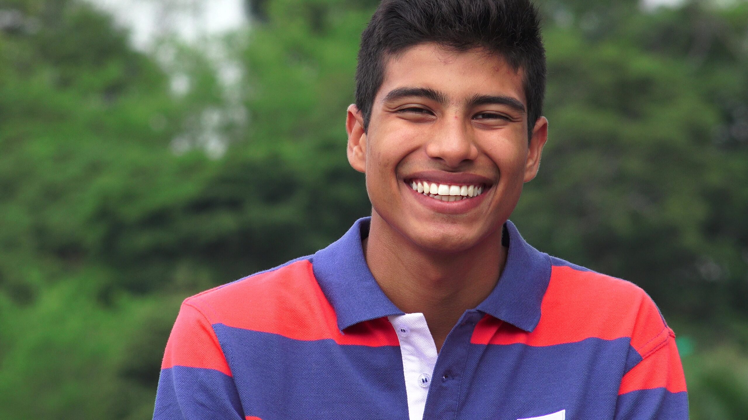 Hispanic Teen Boy Laughing