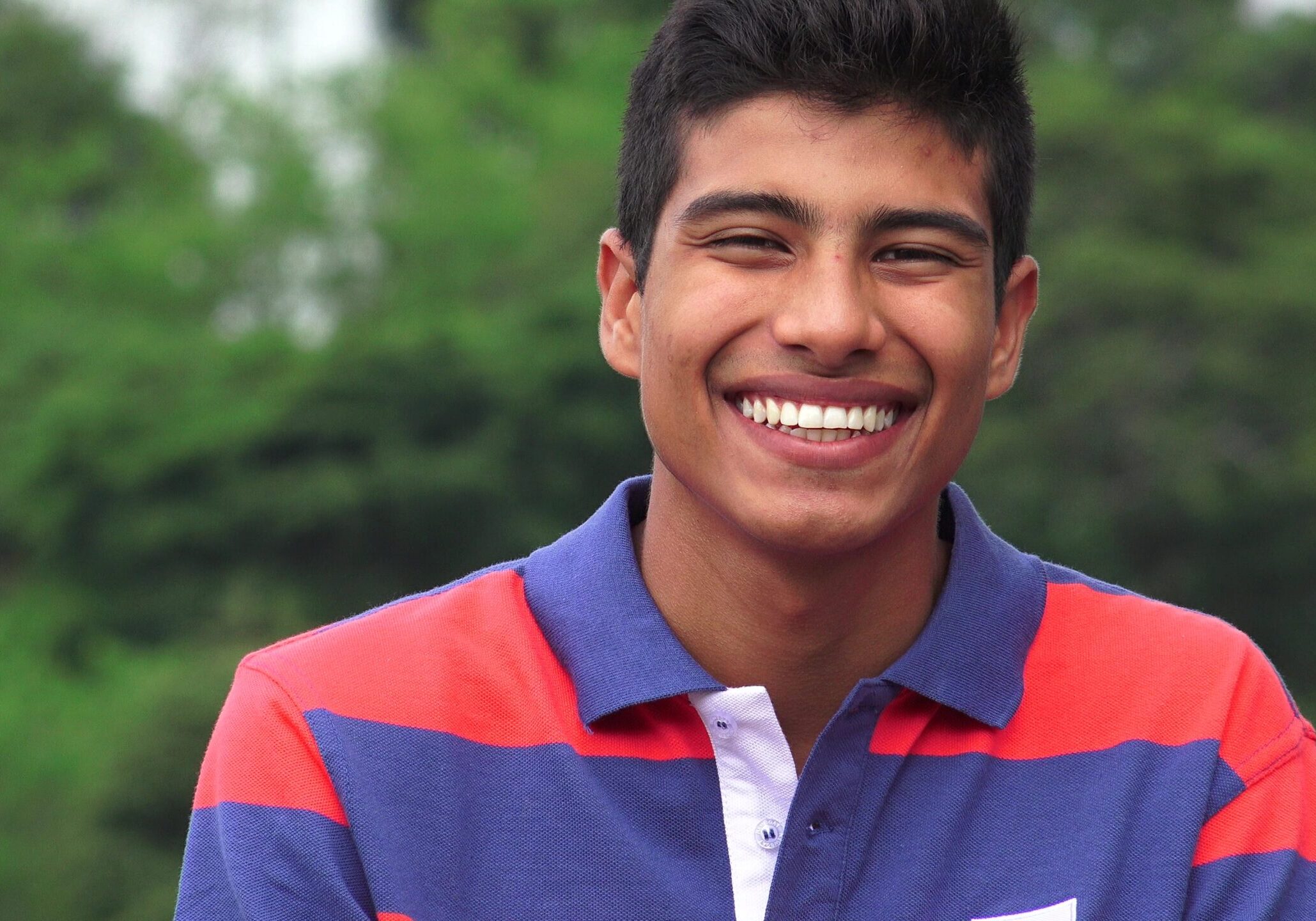 Hispanic Teen Boy Laughing